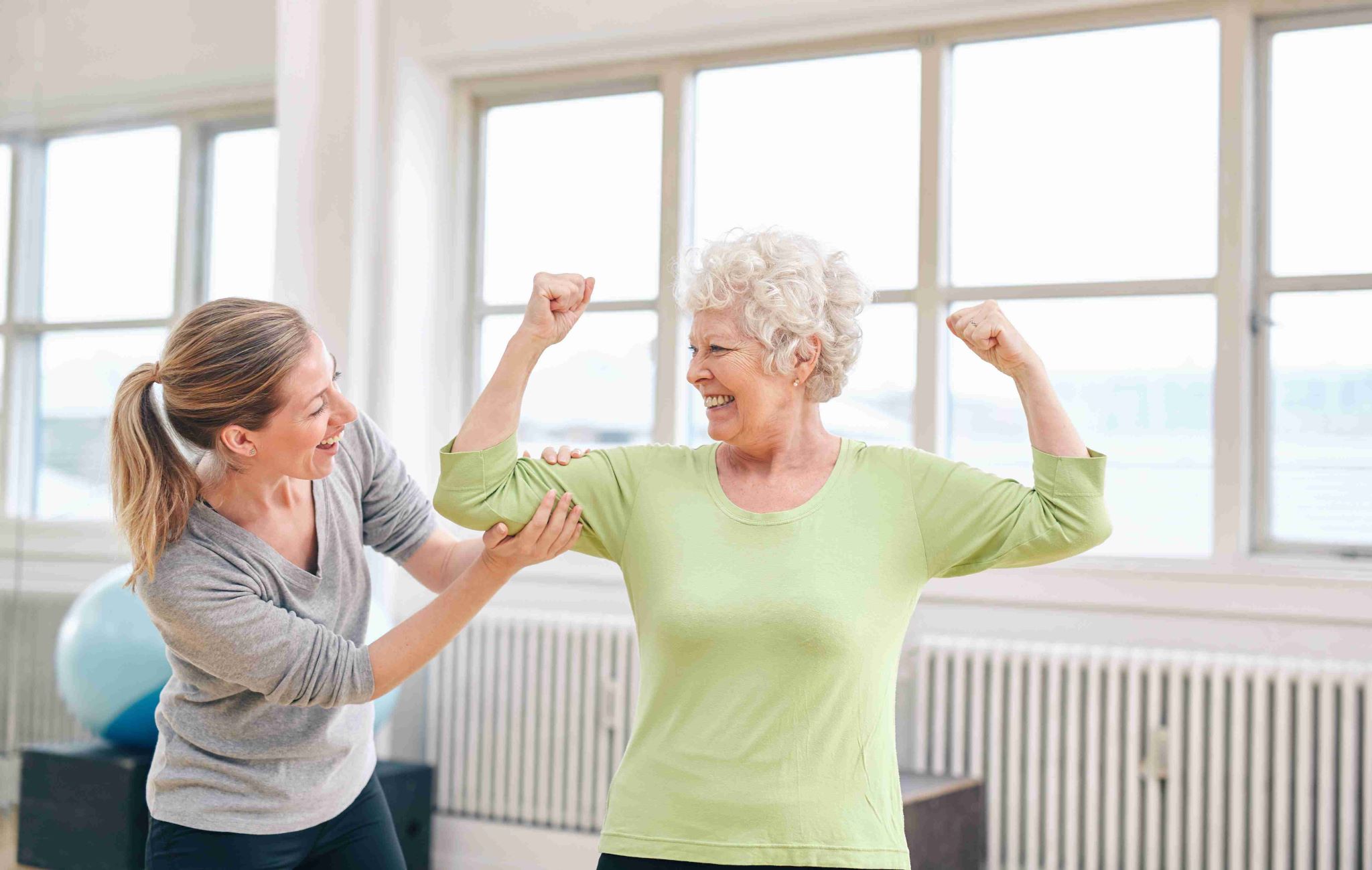 proud elderly woman flexing her bicep with persona P33VH2F compressed